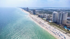 A coastal hotel with multiple high-rise buildings, a beachfront, and a pool area. - HP301 Waterfront Views, Pool, Hot Tub & Dock (Pensacola)