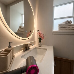 Hair dryer, towels, soap, shampoo