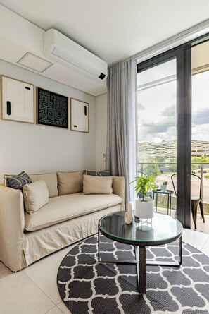 Condo, 1 Bedroom, Patio | Living room | Books - Waterfall City Luxury (Johannesburg)