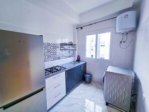 Family Apartment, 3 Bedrooms, Garden View | Private kitchen | Full-sized fridge, stovetop, cookware/dishes/utensils