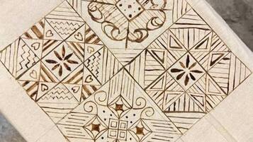 A geometric pattern on a wooden surface.
