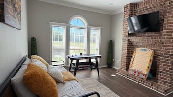 Smart TV, fireplace, foosball, books