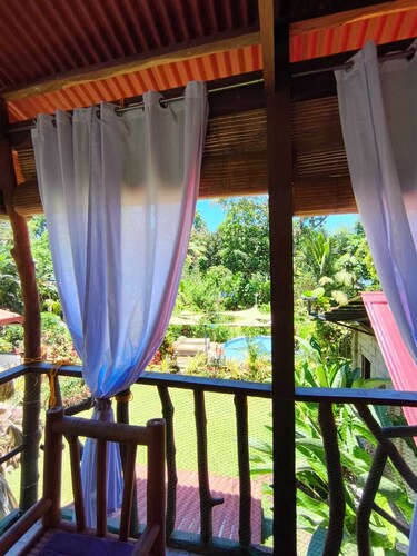 Cozy 2-bedroom house in welcoming Mambajao with AC