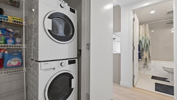 Shower, hair dryer, towels, toilet paper