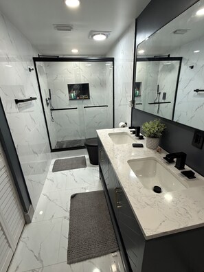 Shower, hair dryer, towels, soap