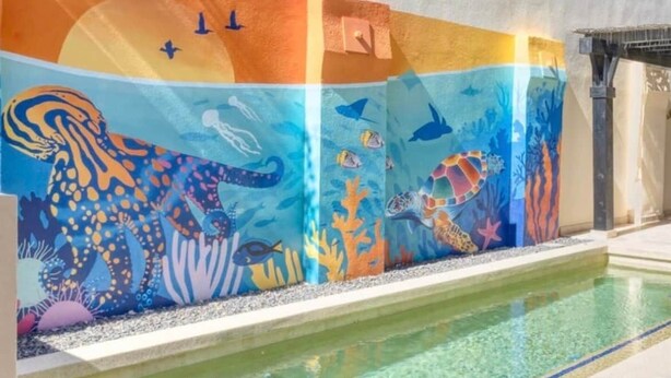A swimming pool with a mural of marine life. - 3-Bedroom Villa - Quivira Los Cabos (Cabo San Lucas)