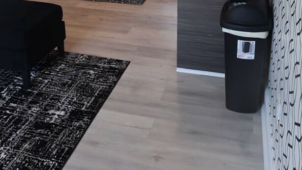 A modern kitchen with white cabinets, a stainless steel refrigerator, a dishwasher, and a coffee maker. - Cozy 1-bedroom apartment in lovely Dallas with AC (Dallas)
