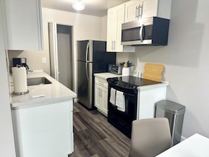 Coffee/tea maker, fridge, microwave, oven
