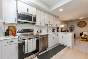 Fridge, microwave, oven, stovetop - Modern 2BR Suite | Private Entry, Parking, Near Trails & Transit (Calgary)