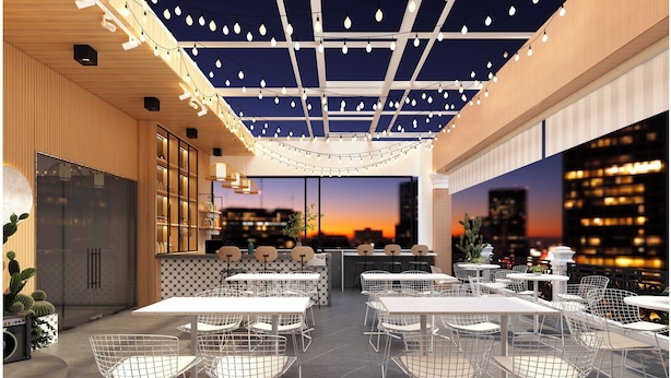 A modern dining area with multiple tables and chairs, a ceiling with string lights, and a city view. - Dong A Hotel Pho Co Ninh Binh (Hoa Lu)