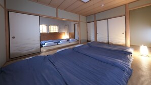 A room with a bed, a window, and sliding doors. - Shakunagedaira Vacation Rental Lot 1 (Inawashiro)