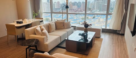Elite Apartment, City View | Living area | 80-cm flat-screen TV with digital channels