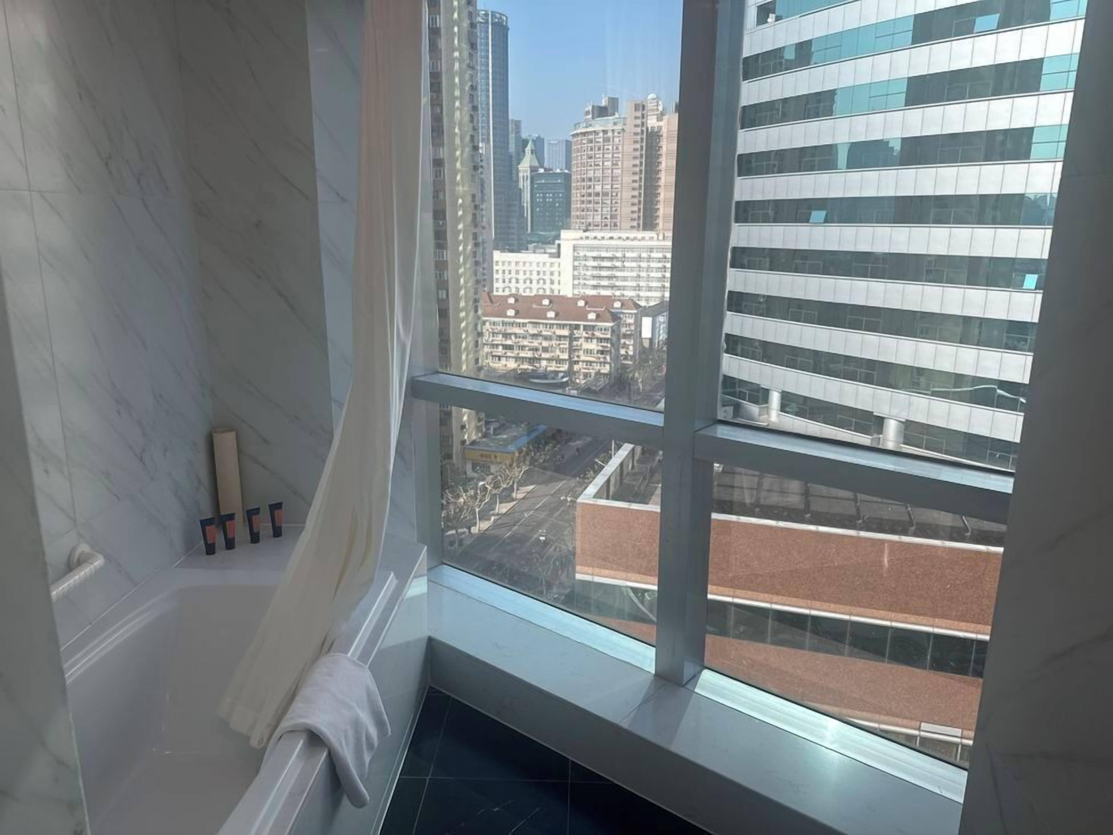 Luxury Suite, City View | Bathroom | Rainfall showerhead, free toiletries, hair dryer, towels