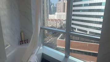 Luxury Suite, City View | Bathroom | Rainfall showerhead, free toiletries, hair dryer, towels