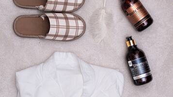 A neatly arranged set of clothing and toiletries on a textured surface.