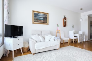 Standard Apartment, Courtyard View | Living area | 30-inch TV with cable channels - Bright 1BR Apt with Sauna & Balcony (Raisio)