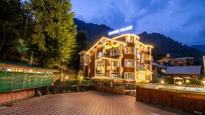 A multi-story building with a sign reading 'Bunyan Palace.' - Bombay Palace (Pahalgam)