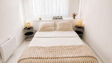 2 dormitorios, tabla de planchar con plancha, wifi y ropa de cama