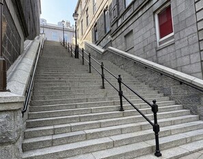 A set of stone steps with black railings leading up to a building entrance. - Super Nova Hotel (Aberdeen)