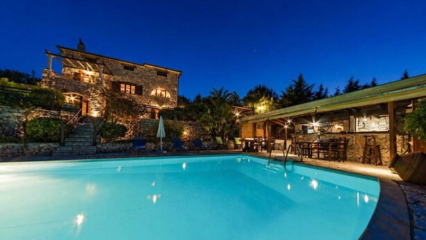 A swimming pool with a stone building in the background. - Villa Poseidon - Executive Suite In Zante w/Pool (Skinaria)