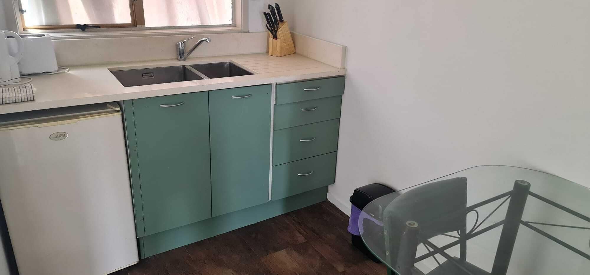 Mini-fridge, microwave, cookware/dishes/utensils