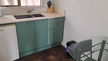 Mini-fridge, microwave, cookware/dishes/utensils