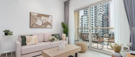 Premium Apartment, 1 Bedroom, Balcony, Canal View | Living area | 55-inch Smart TV with digital channels, Netflix, Hulu