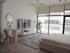Apartment, Balcony, City View | Iron/ironing board, free WiFi - Bright Studio with Rooftop Pool & Gym (Dubai)