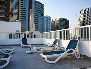 Apartment, Balcony, City View | Property grounds - Bright Studio with Rooftop Pool & Gym (Dubai)