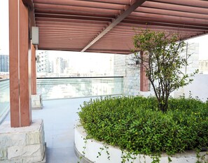 Apartment, Balcony, City View | Property grounds - Bright Studio with Rooftop Pool & Gym (Dubai)