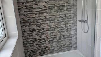 Shower, towels, soap, toilet paper