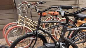 A bicycle with 'PRIORITY' written on the frame, leaning against a building. - Cozy Sunriver Gateway: SHARC, Beautiful Windows, Deck, Games, Bikes (Sunriver)