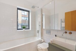 Shower, hair dryer, towels, shampoo