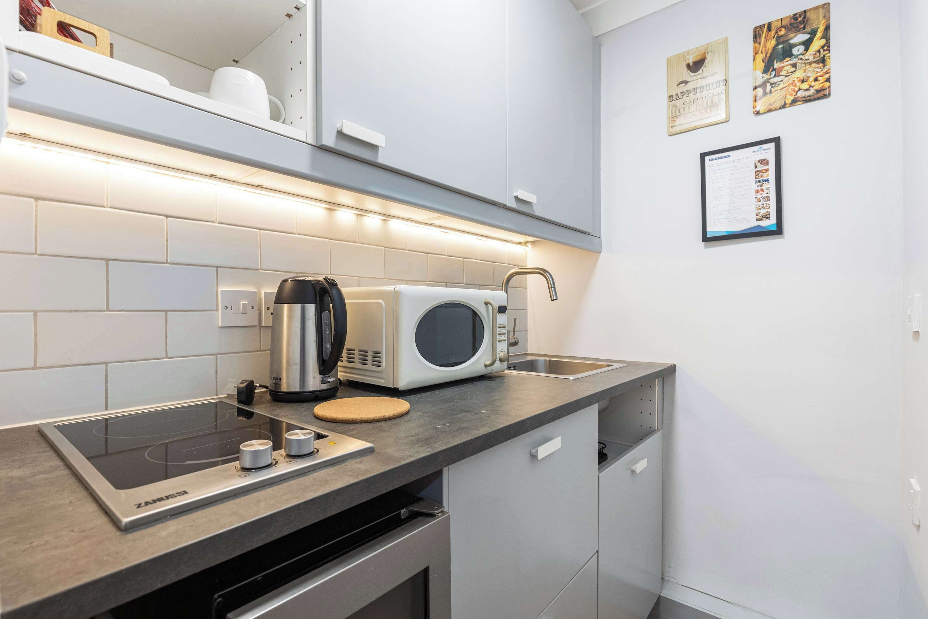 Fridge, microwave, stovetop, coffee/tea maker