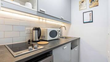 Fridge, microwave, stovetop, coffee/tea maker