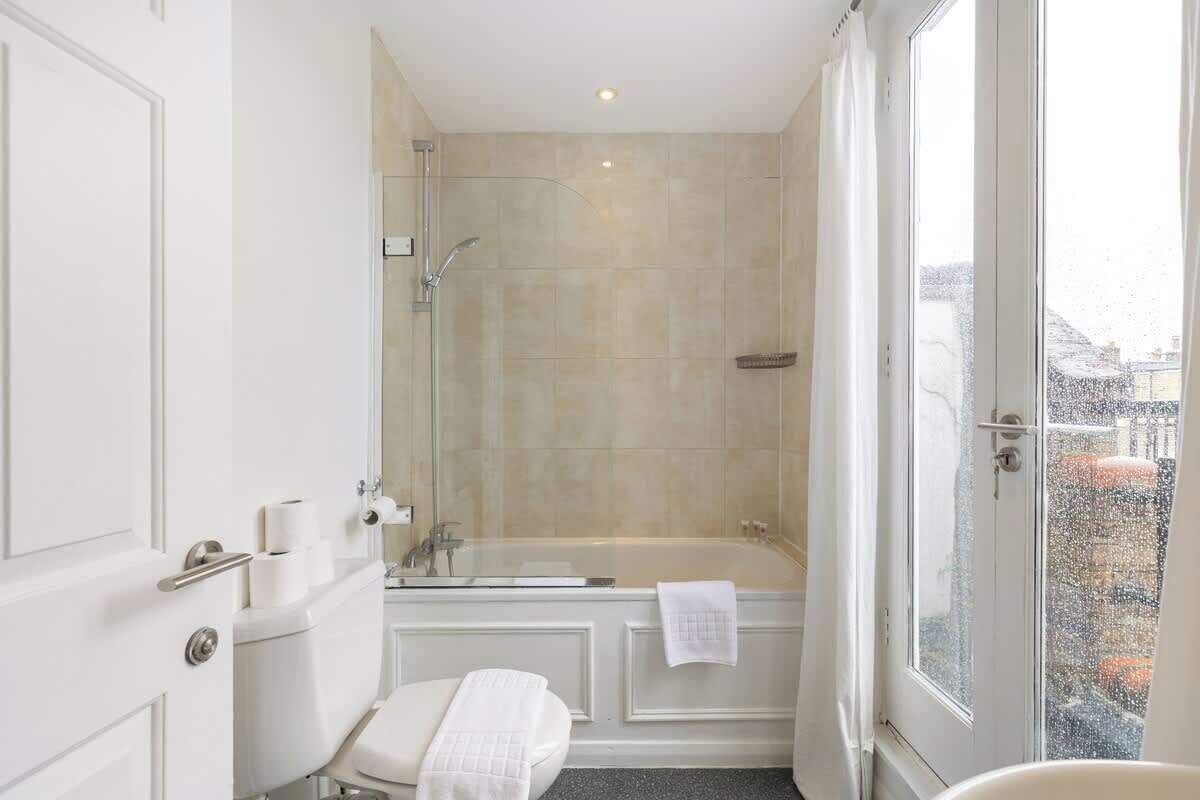 Shower, hair dryer, towels, shampoo