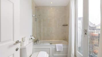 Shower, hair dryer, towels, shampoo