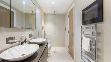 Shower, hair dryer, towels, shampoo