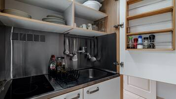 Fridge, microwave, stovetop, coffee/tea maker