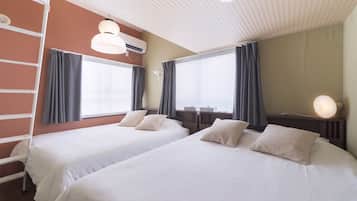 A hotel room with two beds, a ladder, an air conditioning unit, and a large window with curtains.