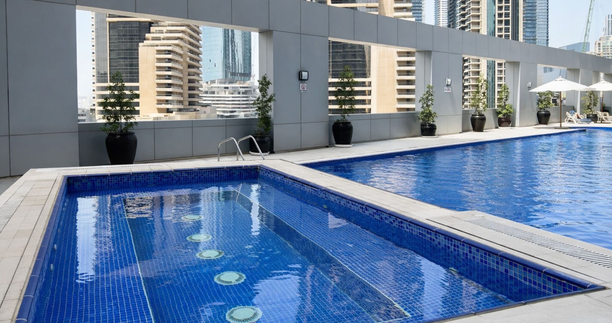 2 outdoor pools, open 8:00 AM to 10:00 PM, pool umbrellas, sun loungers