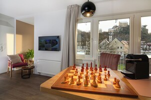 Junior Suite, Balcony, Mountain View | Living area | TV, toys