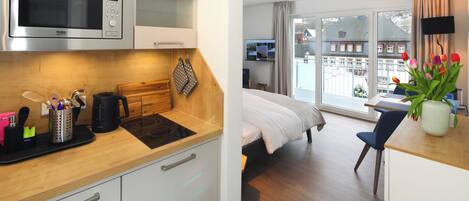 Junior Suite, Balcony, Mountain View | Private kitchen | High chair