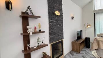 Exclusive Bungalow, 3 Bedrooms, Mountain View | Living area | 50-inch LED TV with satellite channels, heated floors, music library
