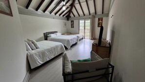 A room with two beds, a chair, a desk, and a ceiling fan. - Luxury Mansion in Barra / Sleeps 50 + Events, Gated Community + 24-hour Security (Rio de Janeiro)
