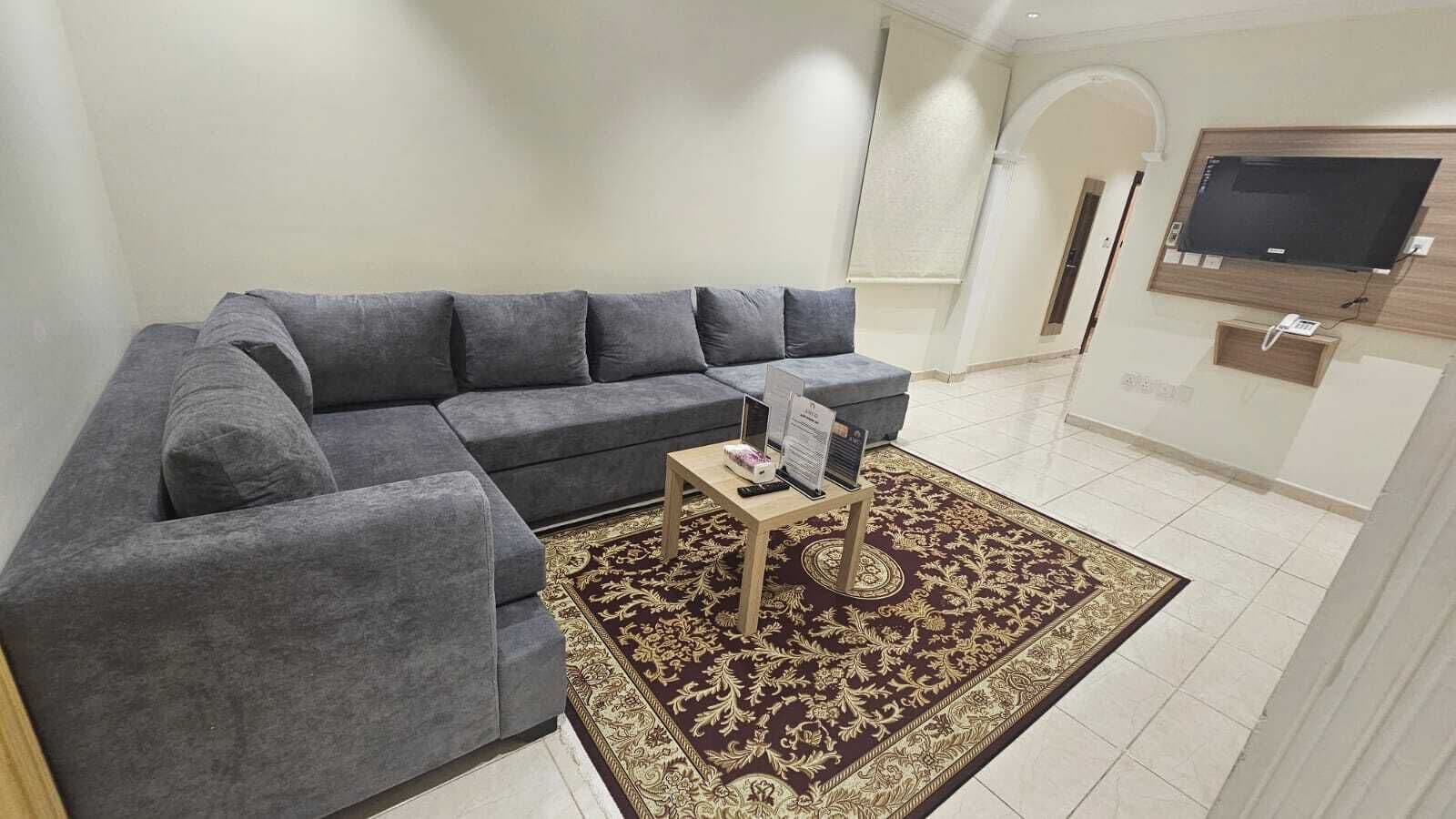 Quarto triplo, 3 camas de solteiro | Área de estar