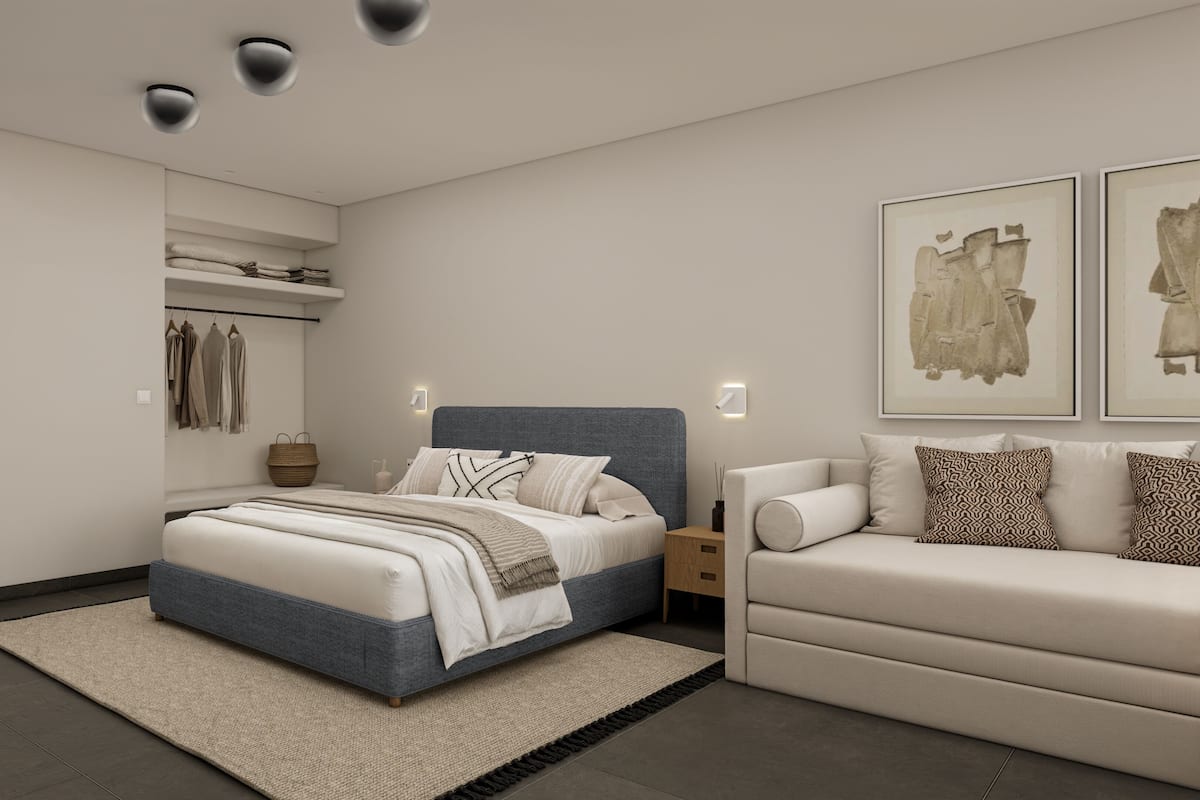 Ein modernes Schlafzimmer mit einem Bett, einer Couch, einem Kleiderschrank und zwei Wandleuchten.
