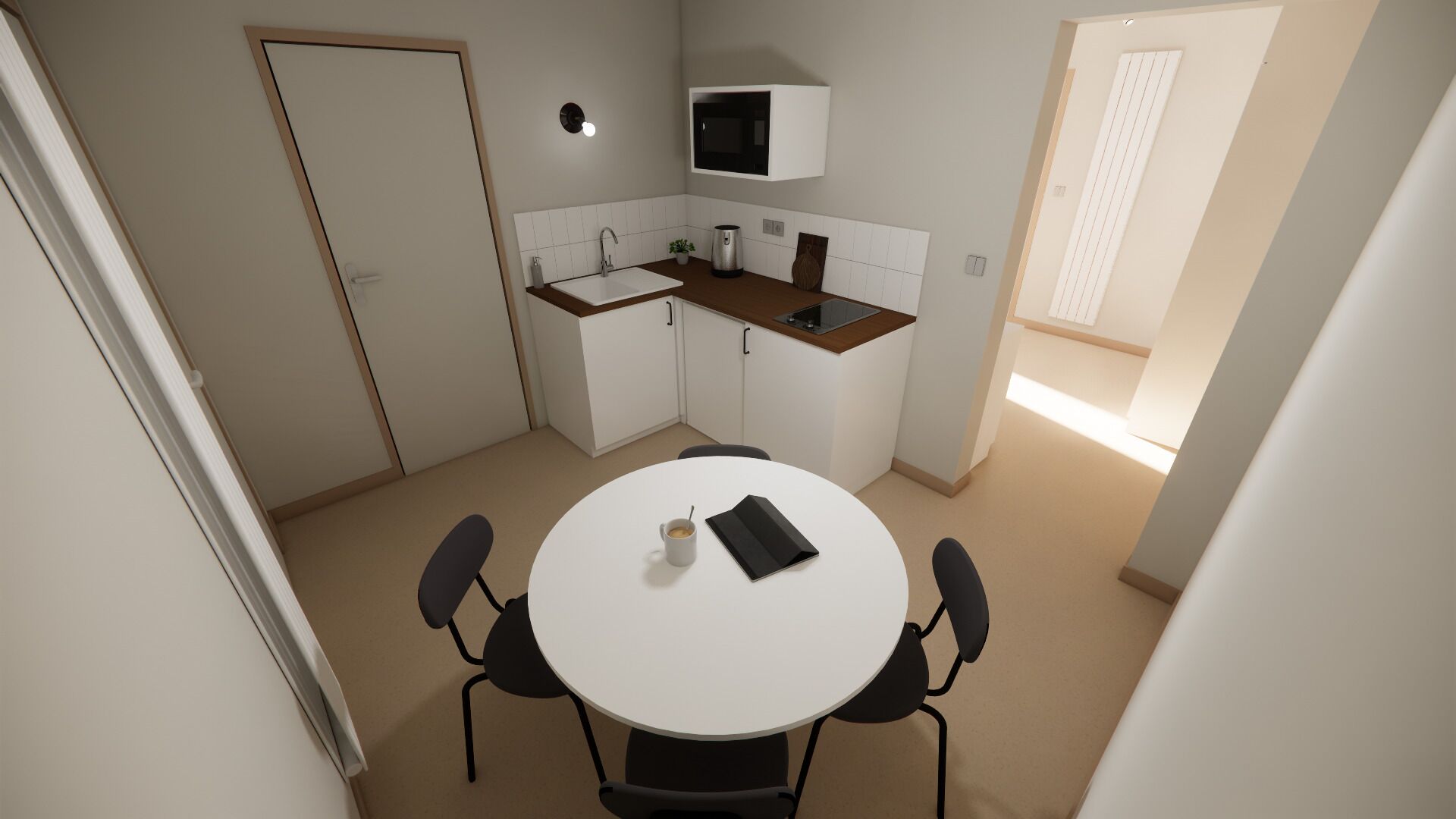 A compact kitchen with a white table, black chairs, a microwave, and a sink.