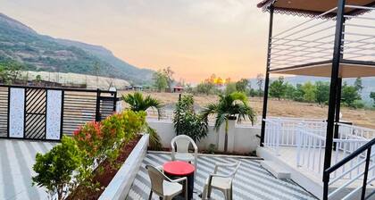 Sanvi farmhouse. Hill view with waterfalls.