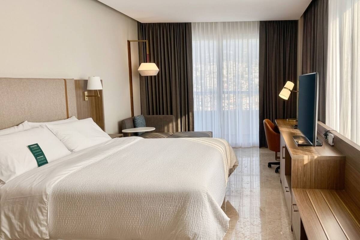 Standard Room, 1 King Bed, City View, Corner | In-room safe, desk, laptop workspace, blackout curtains